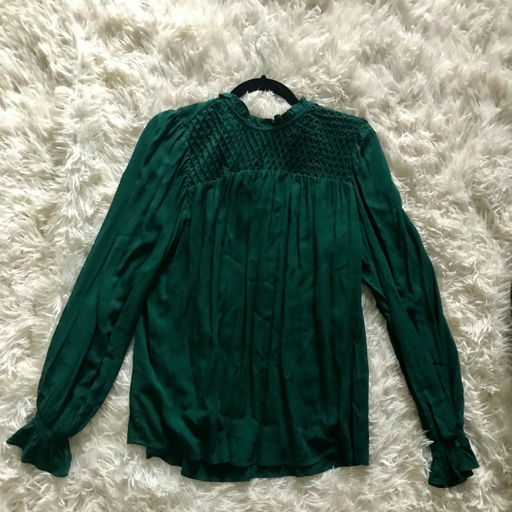 Emerald green with a collared neck. Purchased from Target, size L